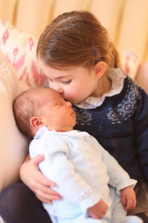 A doting Princess Charlotte is captured kissing her younger brother on the head. (Picture: Kensington Palace)