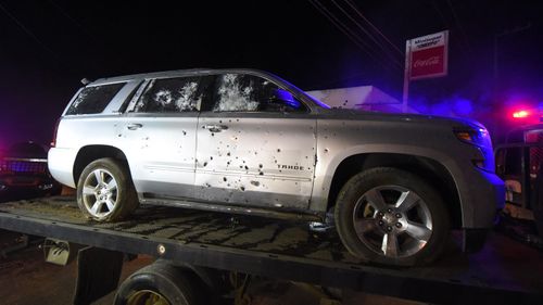 A bullet ridden sports utility vehicle is taken away by authorities after a gun battle with marines in which a man identified by authorities as the leader of the Beltran Leyva drug cartel in 2017.