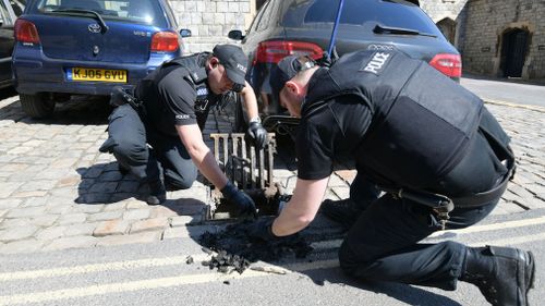 Police check the drains around the castle. Picture: Getty