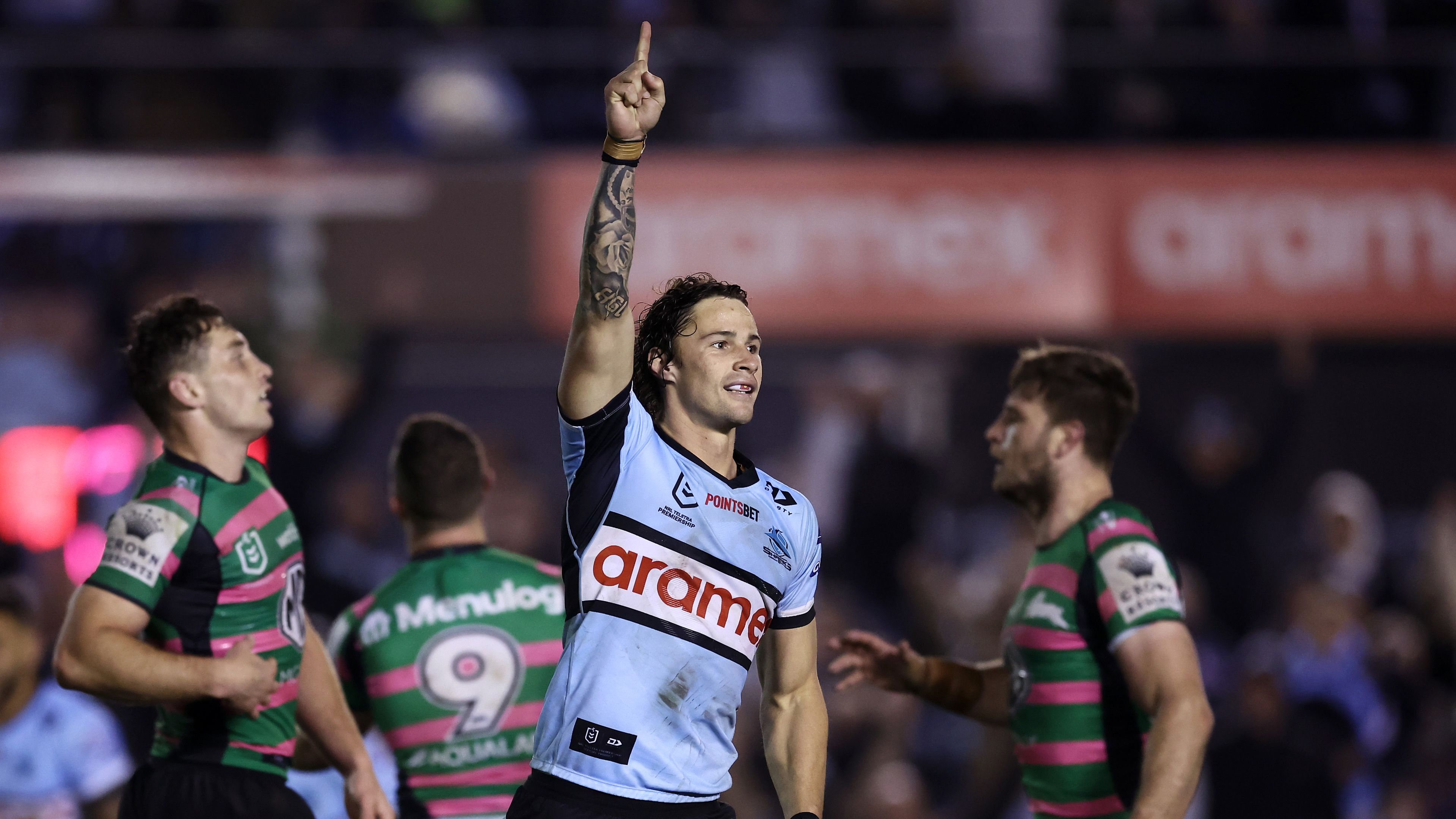 Nicho Hynes of the Sharks celebrates kicking a field goal to win the match in golden point extra time during the round 20 NRL match between the Cronulla Sharks and the South Sydney Rabbitohs at PointsBet Stadium, on July 30, 2022, in Sydney, Australia. (Photo by Matt King/Getty Images)
