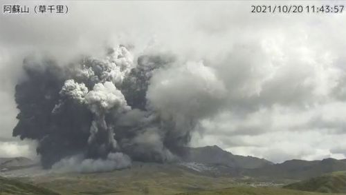 In this image taken by a surveillance camera released by Japan Meteorological Agency, smokes rise from the No. 1 Nakadake crater of Mr. Aso after its eruption, observed from Kusasenri, southwestern Japan, Wednesday, Oct. 20, 2021. The eruption occurred at 11:43 a.m., according to the agency. (Japan Meteorological Agency via AP)