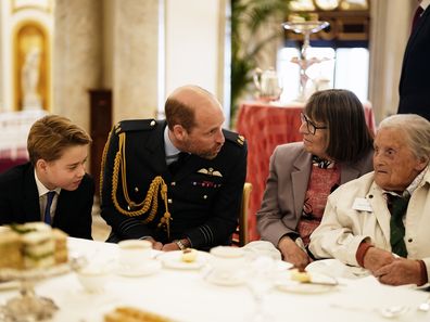 Prince William, Prince of Wales and Prince George join Second World War veterans at a tea party in Buckingham Palace following the military procession to mark the 80th anniversary of VE Day on May 5, 2025 in London, England. 