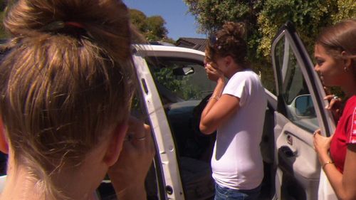 Lacey Harrison reacts at being given a new car. (9NEWS)