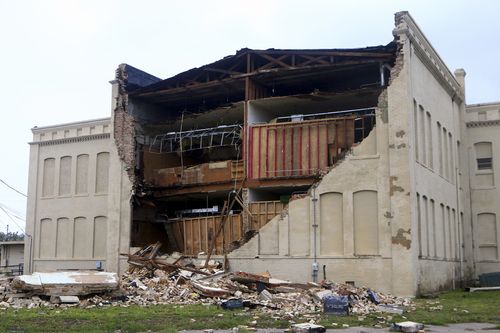 Debris lies on the ground after a building was destroyed by Hurricane Harvey in Aransas Pass. (AAP)