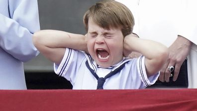 Prince Louis covers his ears from the balcony of Buckingham Place during a fly-past after the Trooping the Color ceremony in London, Thursday, June 2, 2022, on the first of four days of celebrations to mark the Platinum Jubilee. The events over a long holiday weekend in the U.K. are meant to celebrate the monarch&#x27;s 70 years of service.