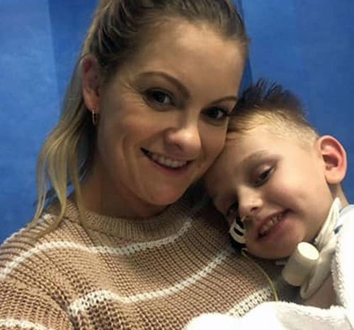 Jacob James and his mother Sheryn share a cuddle in hospital.