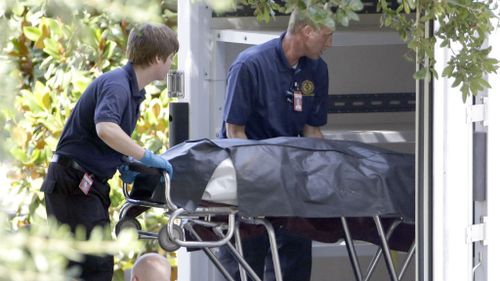 A body is removed from the scene of the standoff in Houston. (AAP)