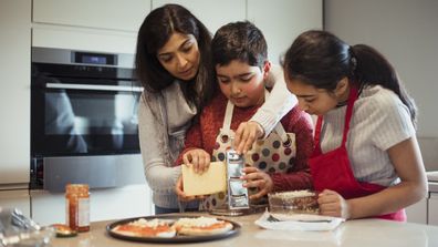 Mother and disabled child cooking