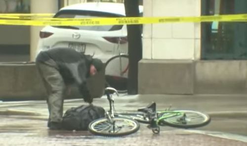 Police cautiously walked around the backpack for several minutes when a random passer-by on a bicycle crossed the police tape. 