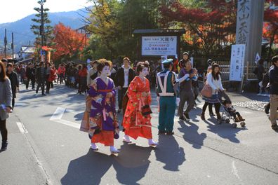 Kyoto, Japan - November 21 2014: geisha walk around the kyoto. geisha are female Japanese performing artists and entertainers trained in traditional Japanese performing arts styles