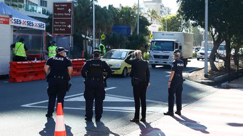 Queensland Police stop vehicles on the Queensland-NSW border in Coolangatta, 