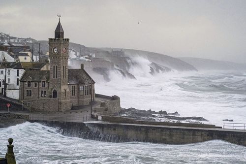 Waves hits Porthleven on the Cornish coast, Britain, as Storm Eunice makes landfall Friday, February 18, 2022. 
