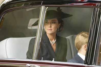 Kate Middleton, the Princess of Wales with Prince George (face obscured) on their way  to the State Funeral of Queen Elizabeth II in London, Britain, 19 September 2022.