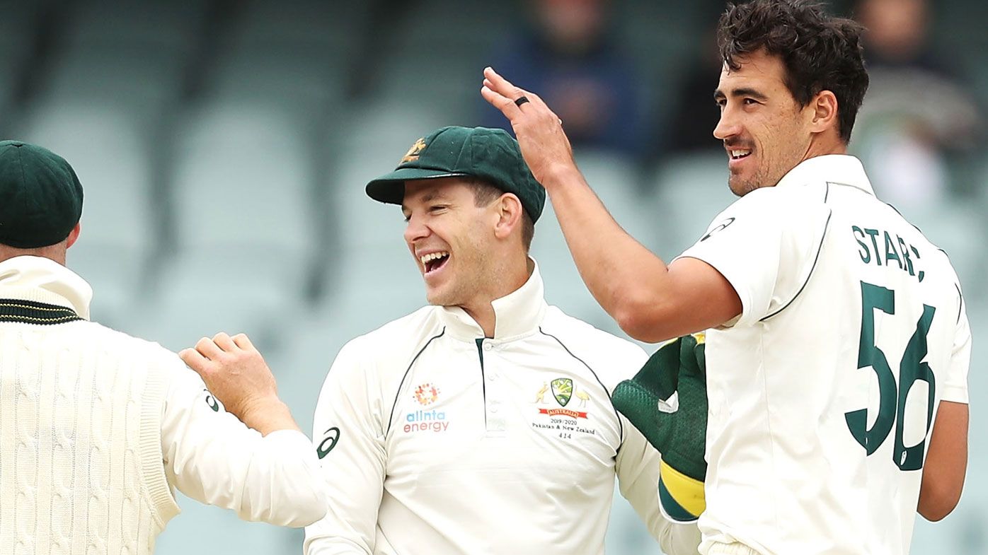 Mitchell Starc of Australia celebrates with his team mates after taking the wicket of Shaheen Shah Afridi