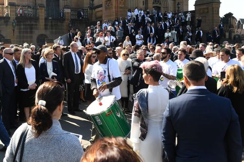 A Samba drummer plays at the State Funeral for veteran soccer broadcaster Les Murray at St. Mary's Cathedral in Sydney. (AAP)