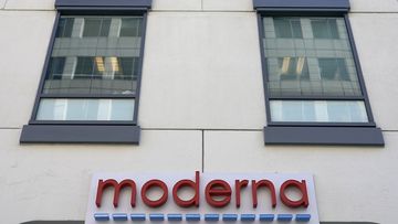 A sign for Moderna, Inc. hangs on its headquarters in Cambridge, Mass.  December 15, 2020 