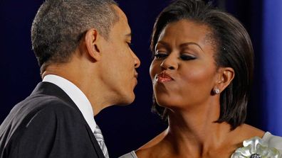 El Presidente enjoys a tight peck.