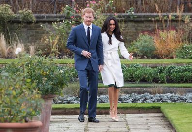 Harry and Meghan attend a photocall in the Sunken Gardens at Kensington Palace following the announcement of their engagement on November 27, 2017.