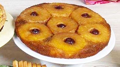 Retro 70's pineapple upside-down cake with glace cherries