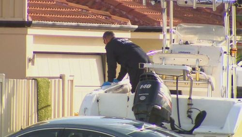 Forensics officers were on the scene, searching the Perth property for clues.