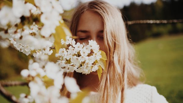 Woman smelling flowers