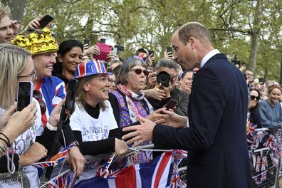 Prince William greets well-wishers outside Buckingham Palace, in London, Friday, May 5, 2023 a day before his coronation takes place at Westminster Abbey.
