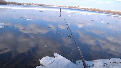 Richard Gorda reeling in the stranded boy.