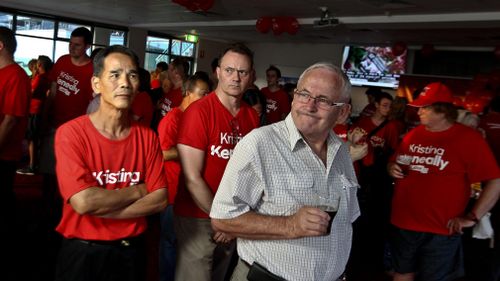 Labor supporters watch the results swaying towards the Liberals in preparation for Kristina Keneally at the Phoenix room at Club Ryde in Sydney. (AAP)
