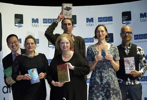 From left to right, authors, Malaysian Tan Twan Eng, Deborah Levy, Hilary Mantel, Will Self, holding his book, above, Alison Moore and Jeet Thayil, from India, Man Booker Prize nominee, holding copies of their books during a photo interview at the Royal Festival Hall, in London, on October 15, 2012