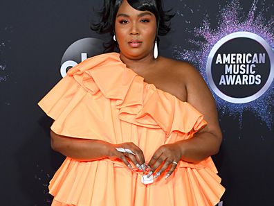 Lizzo Wore the World's Tiniest Handbag to the American Music Awards