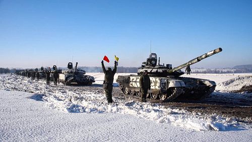 In this photo taken from video provided by the Russian Defense Ministry Press Service on Tuesday, Feb. 15, 2022, Russian army tanks stand ready to move back to their permanent base after drills in Russia.  