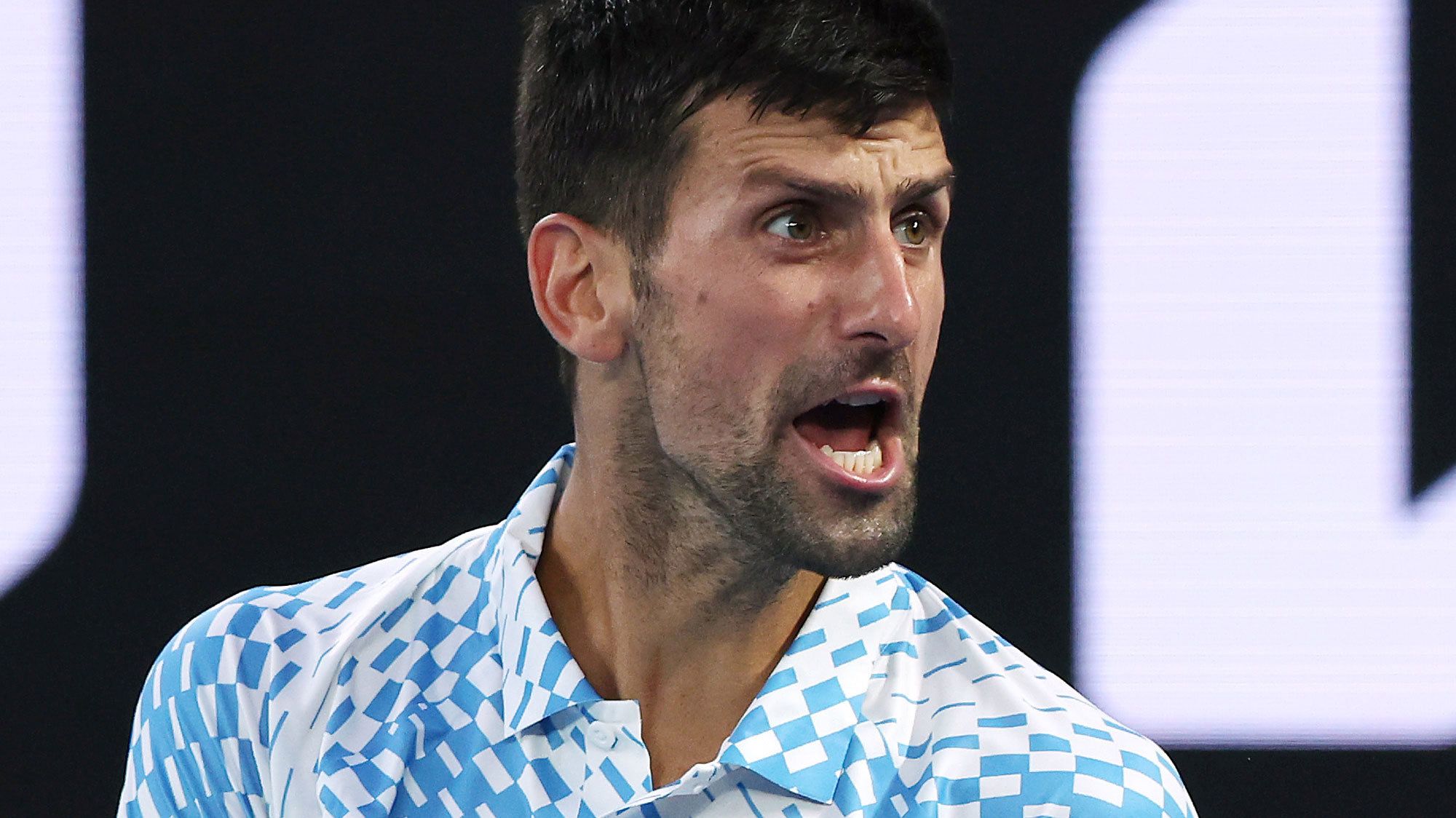 Novak Djokovic reacts in the quarter final singles match against Andrey Rublev at the 2023 Australian Open.