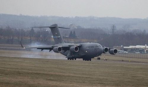 A U.S. Army transport plane landing at the Rzeszow-Jasionka airport in southeastern Poland on Sunday, Feb. 6, 2022, bringing from Fort Bragg  troops and equipment of the 82nd Airborne Division. Additional U.S. troops are arriving in Poland after President Joe Biden ordered the deployment of 1,700 soldiers here amid fears of a Russian invasion of Ukraine. Some 4,000 U.S. troops have been stationed in Poland since 2017. (AP Photo/Czarek Sokolowski)