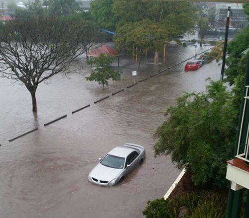 A flooded car in Fisher St, Brisbane. (Supplied, Jessy Webster)