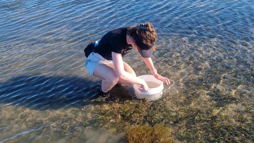 Rowan Carew hunts for endangered White's Seahorses in sea grass.