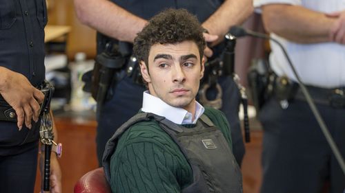FILE - Luigi Mangione , accused of fatally shooting the UnitedHealthcare CEO Brian Thompson in New York City and leading authorities on a five-day search is scheduled, appears in court for a hearing, Friday, Feb. 21, 2025, in New York. (Steven Hirsch/New York Post via AP, Pool, File)