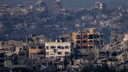 Destroyed buildings by Israeli bombardments as seen inside the Gaza Strip from southern Israel.