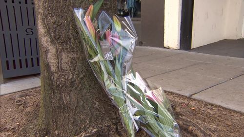 Flowers are laid at the scene of the tragedy.