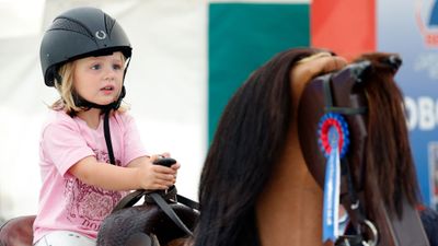 Mia Tindall rides a horse simulator, August 2017