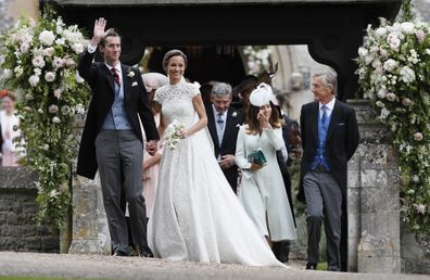 Pippa Middleton and James Matthews smile after their wedding at St Mark's Church in Englefield, England.