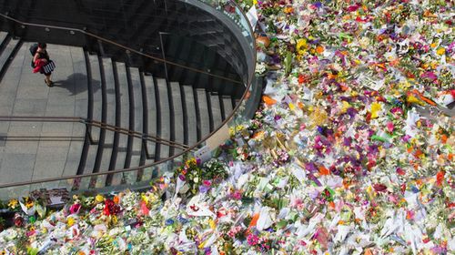 The floral shrine in Martin Place has swelled to a truly extraordinary tribute to the siege victims. (Getty)
