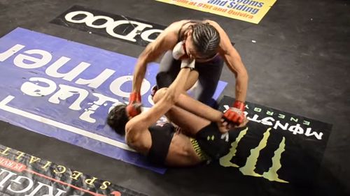 Sharice Davids used to be an MMA cage-fighter. In this screenshot, she's the fighter still standing.