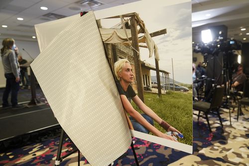 A photo of cinematographer Helyna Hutchins is displayed before a news conference by attorney Gary Dordick and his client Serge Svetnoy, chief of lighting on the "Rust' film set, to announce a lawsuit against Alec Baldwin and others in Beverly Hills, Calif., on Nov. 10, 2021. A judge on Friday, Dec. 10, has decided that the assistant director who handed Alec Baldwin a prop gun that killed cinematographer Hutchins on a New Mexico film set must make himself available for an interview with st