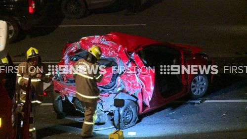 A woman was pulled from her vehicle and taken to hospital. (9NEWS)