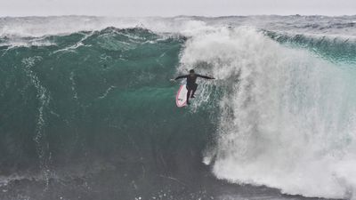 Surfer falls from board 