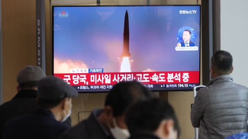 A TV screen shows a file image of North Korea's missile launch during a news program at the Seoul Railway Station in Seoul, South Korea, Wednesday, November 2, 2022. 