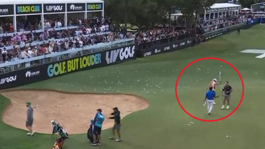 Bottle hits Aussie’s caddie as ‘watering hole’ goes off