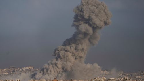 Israel declared Gaza's largest city a combat zone and recovered the remains of two hostages on Friday as the army launched the start of a planned offensive that has drawn international condemnation.