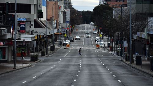 Shoppers walk on George Street in Liverpool, Sydney.