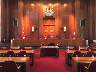 The chamber of the Supreme Court of Canada with the Canadian Coat of Arms